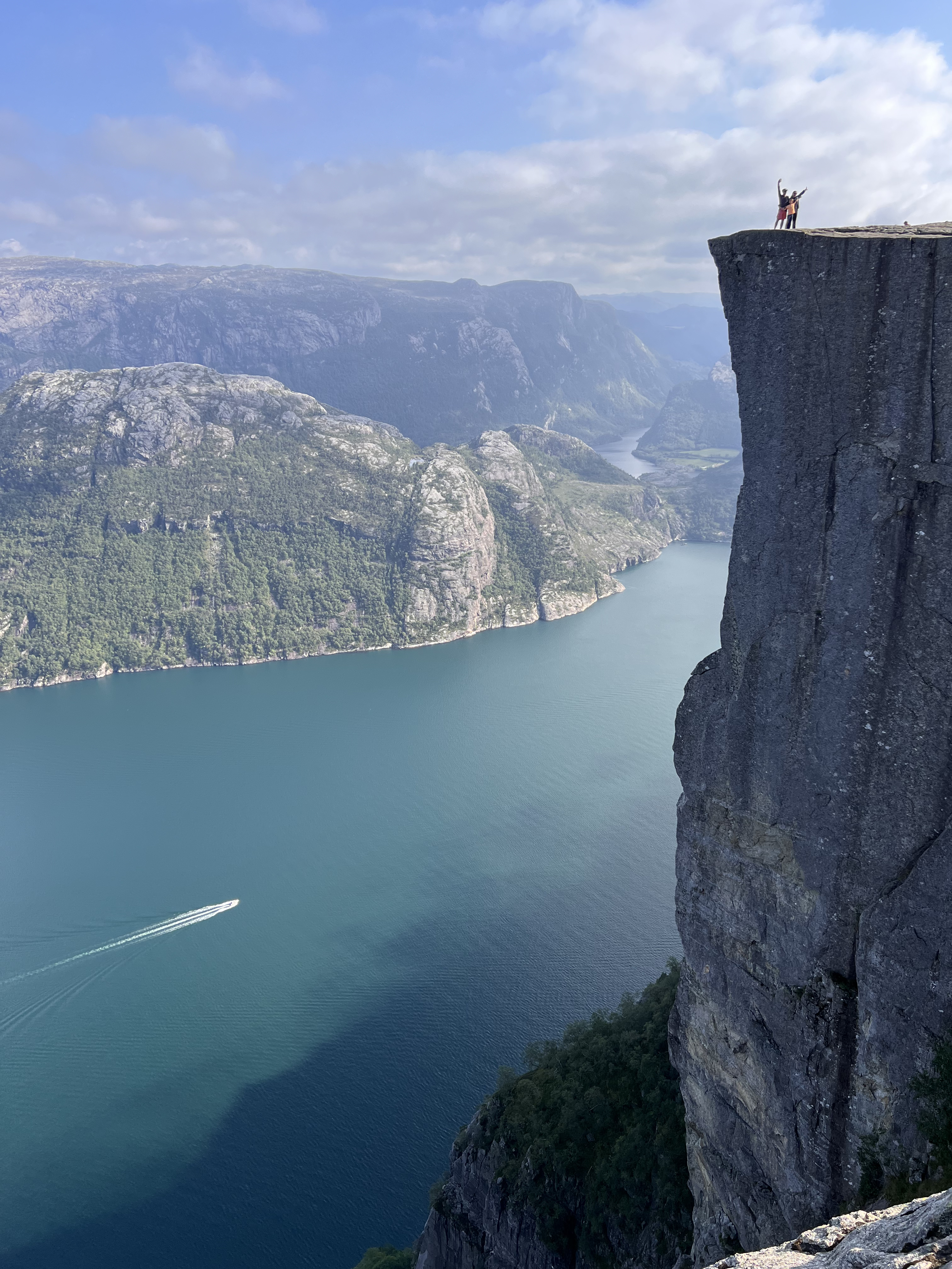 high cliff on mountain background with a river